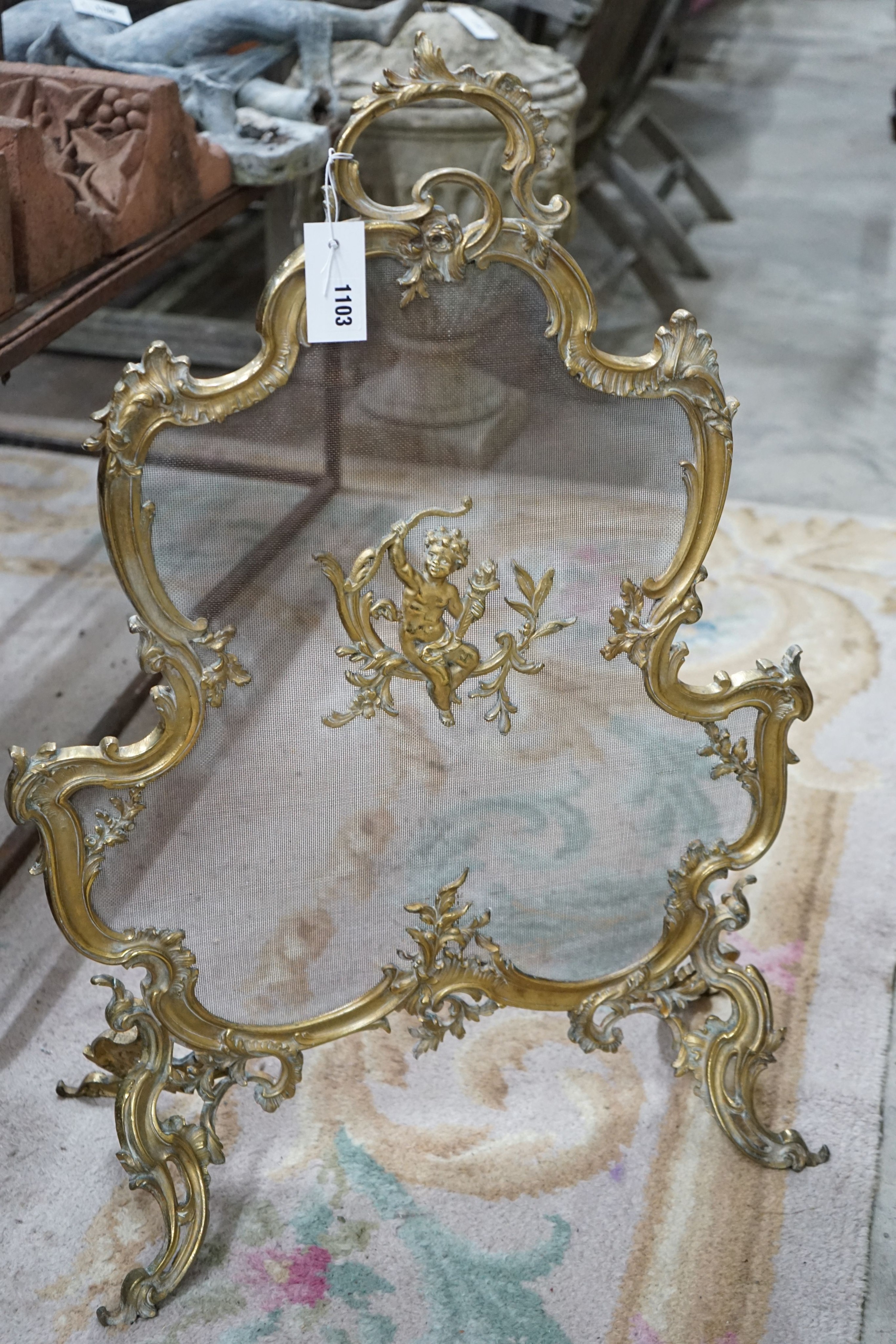 A Rococo style gilt metal mesh firescreen, width 58cm, height 82cm